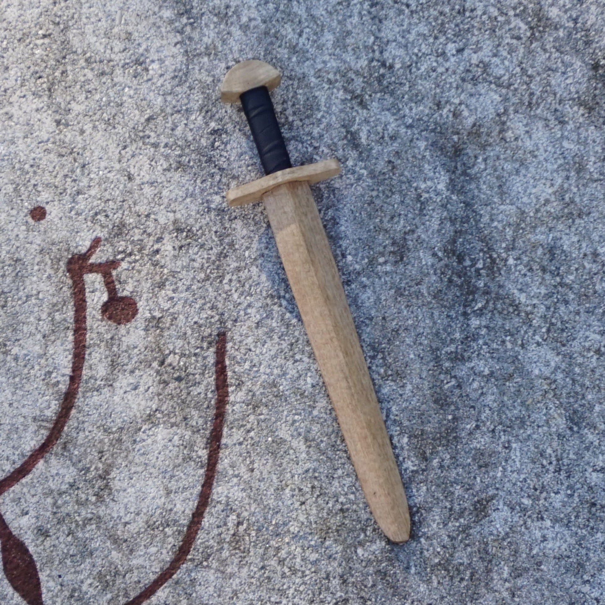 Guerrier à l'épée en bois
