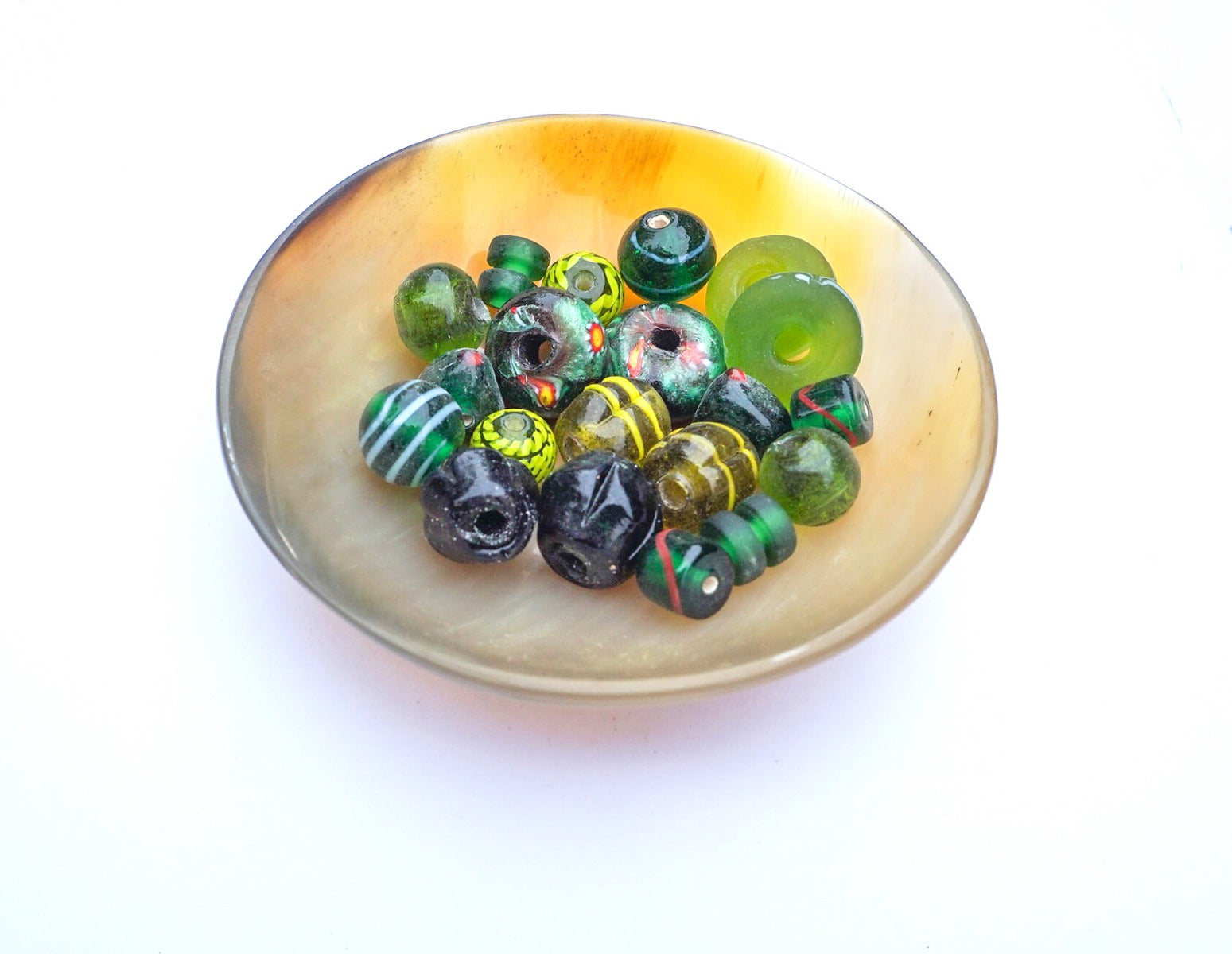 Mix of green historical glass beads