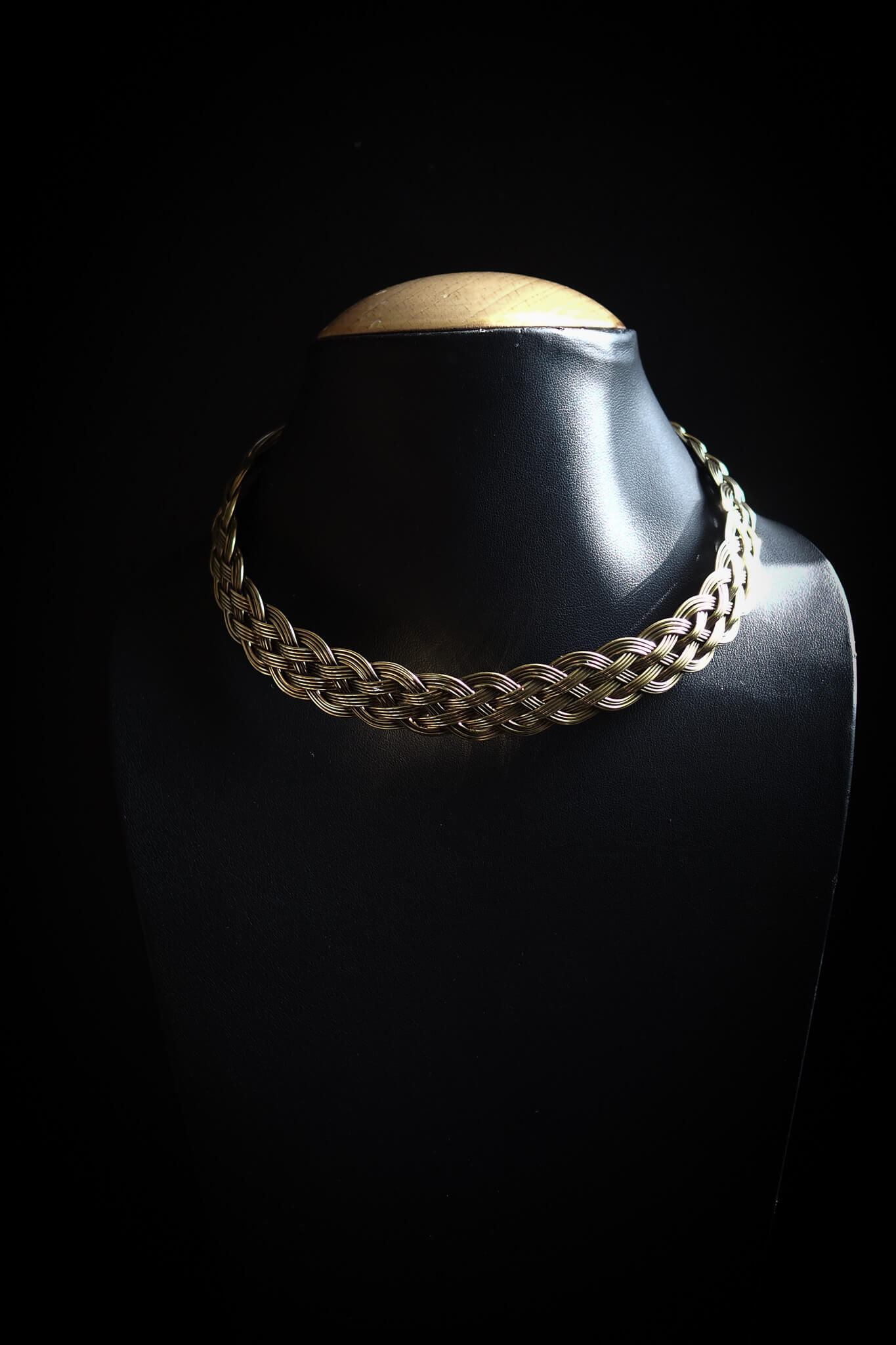 Brass braided necklace.