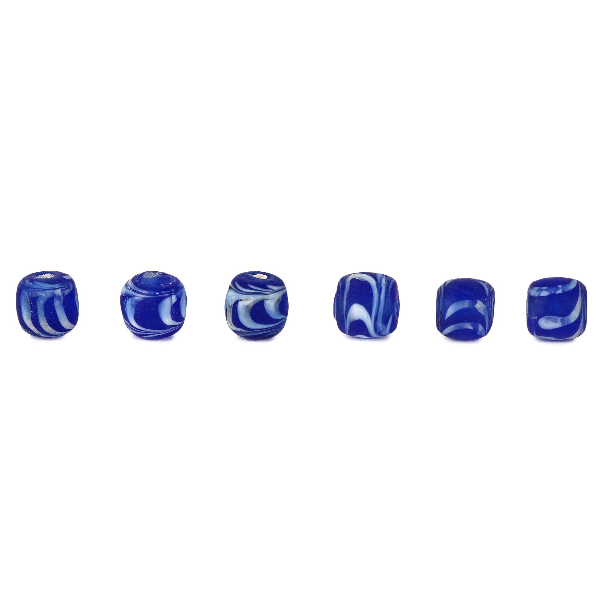 Blue glass bead with white decoration
