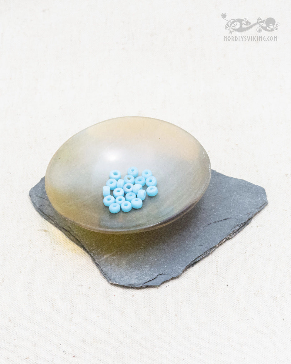 Small light blue glass beads, 100 grams